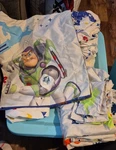 Complete Toy Story Twin Bedding Set: Sheets, Cases, 2 Curtain Panels Ties. Fixed Price $12.00.